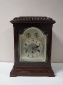 An early 20th century German bracket clock with pendulum and key.
