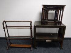 A two-tier dumb waiter trolley together with a nest of three oak tables and a mahogany towel rail
