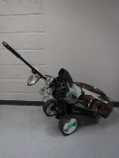 A Nike golf bag and a set of Mitsushiba irons and a King Cobra diver