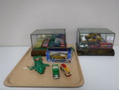 Two leaded glass miniature counter top display cabinets containing die cast vehicles including a
