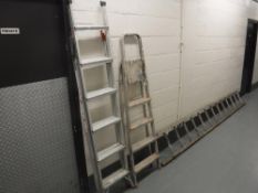 Two pairs of aluminium steps and a wooden ladder