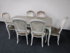 A contemporary French shabby chic dining table with six chairs