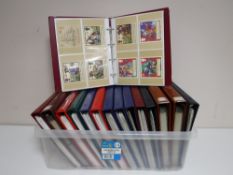 Fifteen albums of Royal Mail Stamp Card Series postcards.