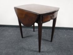 An inlaid mahogany flap sided table