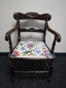 A Victorian mahogany tapestry upholstered armchair