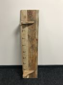 A pine hat and coat wall rack