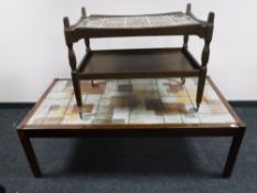 A Danish oak two tier tile top trolley together with a tile topped coffee table