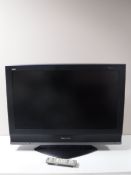 A Panasonic Viera 32 inch LCD TV with remote and a Humax free view box and remote