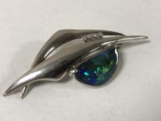 An 18ct white gold opal and diamond brooch, 9.