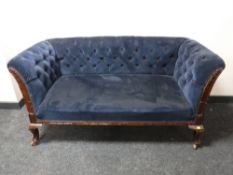 A mahogany framed window settee upholstered in a blue button dralon on Queen Anne legs
