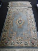 Two fringed Chinese rugs on blue ground CONDITION REPORT: These measure 200cm by
