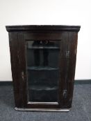 A Victorian oak corner cabinet