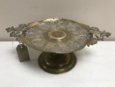 A late 19th century silvered brass comport stand with central coin, width 32 cm.