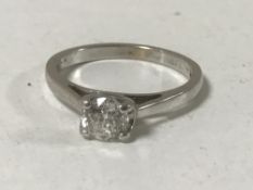 An 18ct white gold diamond solitaire ring,
