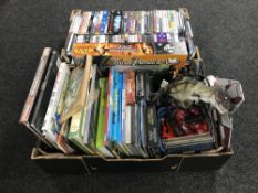 Two boxes of assorted toys including Star Wars, Trivial Pursuit, DVDs,