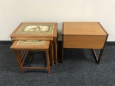 A nest of three teak Danish tile top tables together with a teak storage sewing box
