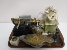 A tray of brass embossed bellows, onyx telephone, antique brass carriage lamp, flat iron,