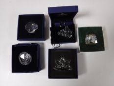 Four boxed Swarovski Crystal ornaments - clam shell, flower, lock and handbag,