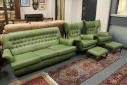 A mid 20th century G Plan The Sixty Two lounge suite comprising of a pair of swivel wing chairs,