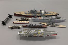 A collection of military model war ships and aircraft carriers.