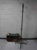 A contemporary metal hat and coat stand together with a frameless bevelled edge mirror