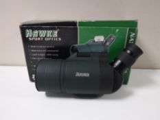 A boxed Hawke Sports optics spotting scope