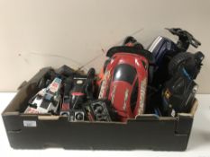 A box of remote control cars and vehicles