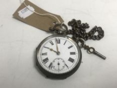 A sterling silver cased pocket watch with key on chain