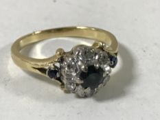 A 18ct gold sapphire cluster ring,