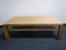 A contemporary oak two tier coffee table