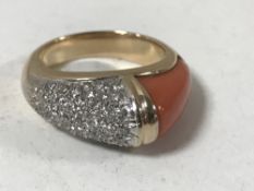 An 18ct gold coral and diamond ring CONDITION REPORT: Size N.