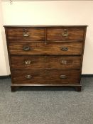 A Victorian five drawer chest on bracket feet,