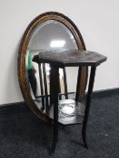 A carved two-tier plant stand together with an Edwardian oak framed bevel edged mirror