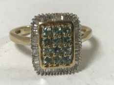 A 9ct gold chrysoberyl and baguette cut diamond ring, size N.