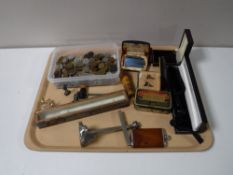 A tray containing a collection of foreign coinage, cased cufflinks, boxed Ronson lighter,