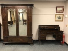A late Victorian inlaid mahogany double mirror door wardrobe with matching dressing table. (2).