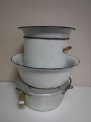 A stainless steel lidded jam pan and four pieces of enamelled ware