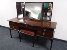 A Stag Minstrel kneehole dressing table with triple mirror and stool