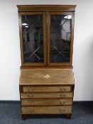 A Victorian inlaid mahogany bureau bookcase