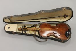 A mid twentieth century violin and bow, labelled within F.