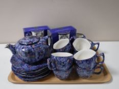A twenty seven piece Ringtons chintz pattern tea service and two boxed Ringtons commemorative mugs