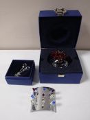 Nine miniature Swarovski Crystal tulips on display stand, a bunch of tulips and tulips in vase.