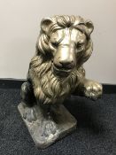 A gold painted garden lion