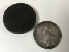 An early 18th century silver commemorative medal - Anne, The Union with Scotland, 70mm diameter,