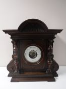 A Victorian aneroid barometer in carved mahogany case.