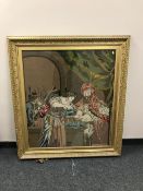 A 19th century embroidery depicting a man washing his hands, 85 cm x 97 cm, framed.