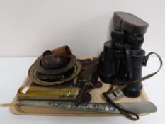 A tray of brass Art Nouveau wall bracket, shoe horn, Eastern knives in sheaths, wooden bowls,