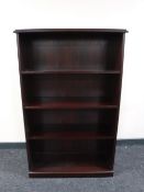 A set of mahogany effect open bookshelves