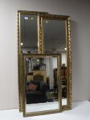 Two gilt framed bevel edged hall mirrors together with one other