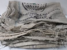 Approximately nineteen hessian coffee sacks bearing advertising